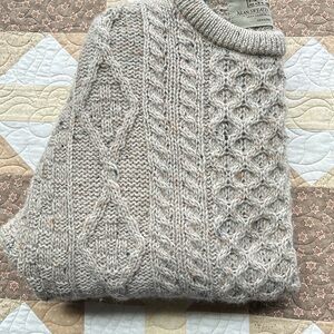 Imported crew neck tweed style sweater.
